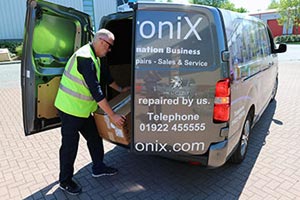 man loading repair collection into van